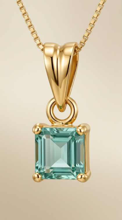 Dije en oro amarillo 18K con Turmalina