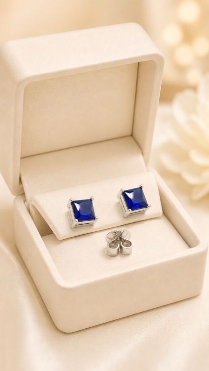 Topos en oro blanco 18K con Espinela Azul