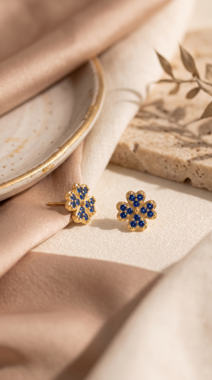 Topos en oro amarillo 18K con Circon Azul