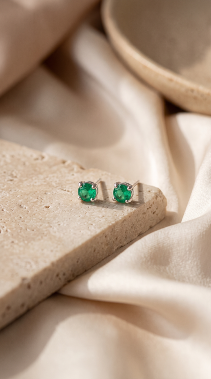 Topos en oro blanco 18K con Esmeraldas